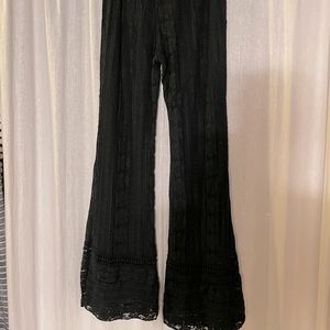 Vintage 70’s-black stretch lace flare pants. The fit is low rider-sz 6